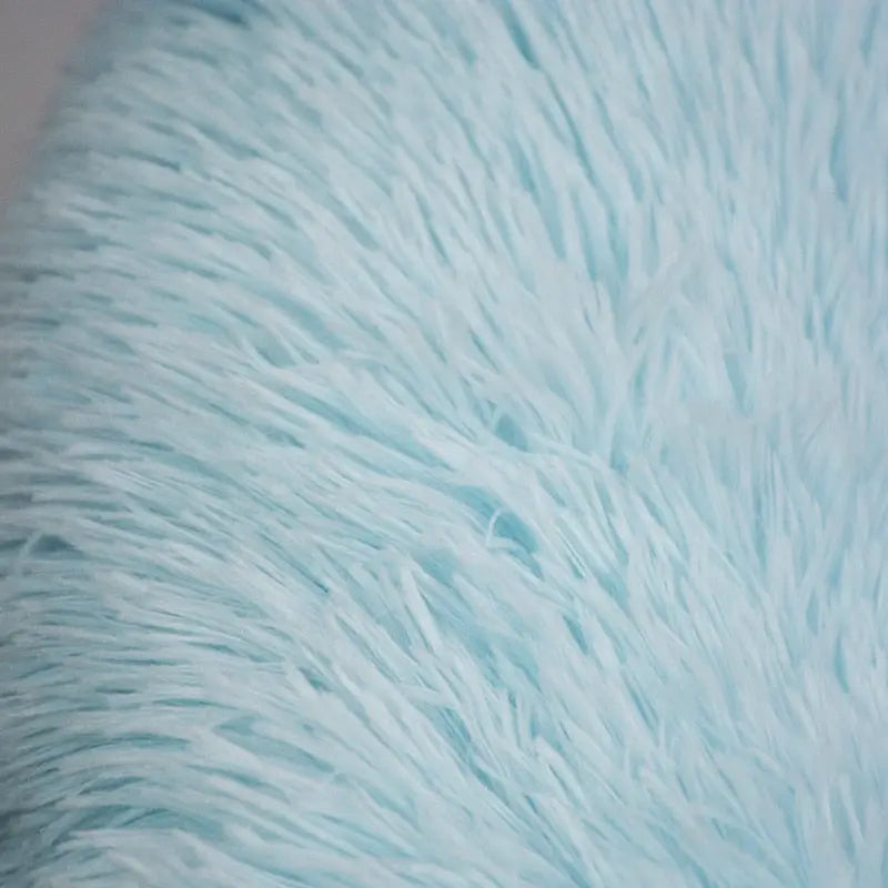 Le tissu en fourrure bleue offre un repos douillet - Canapé pour chien en tissu feutré
